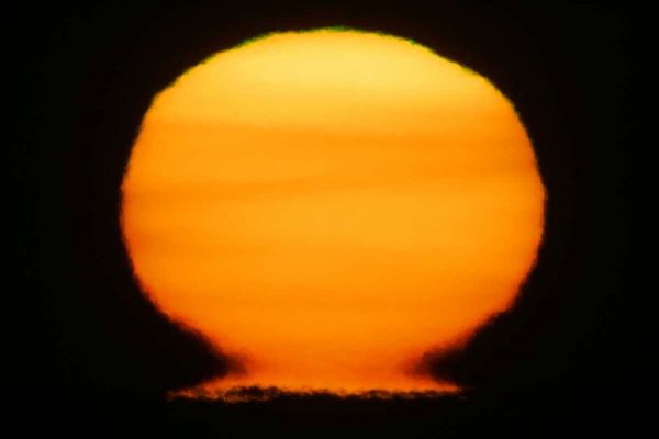 AK, Homer Sun at sunset distorted